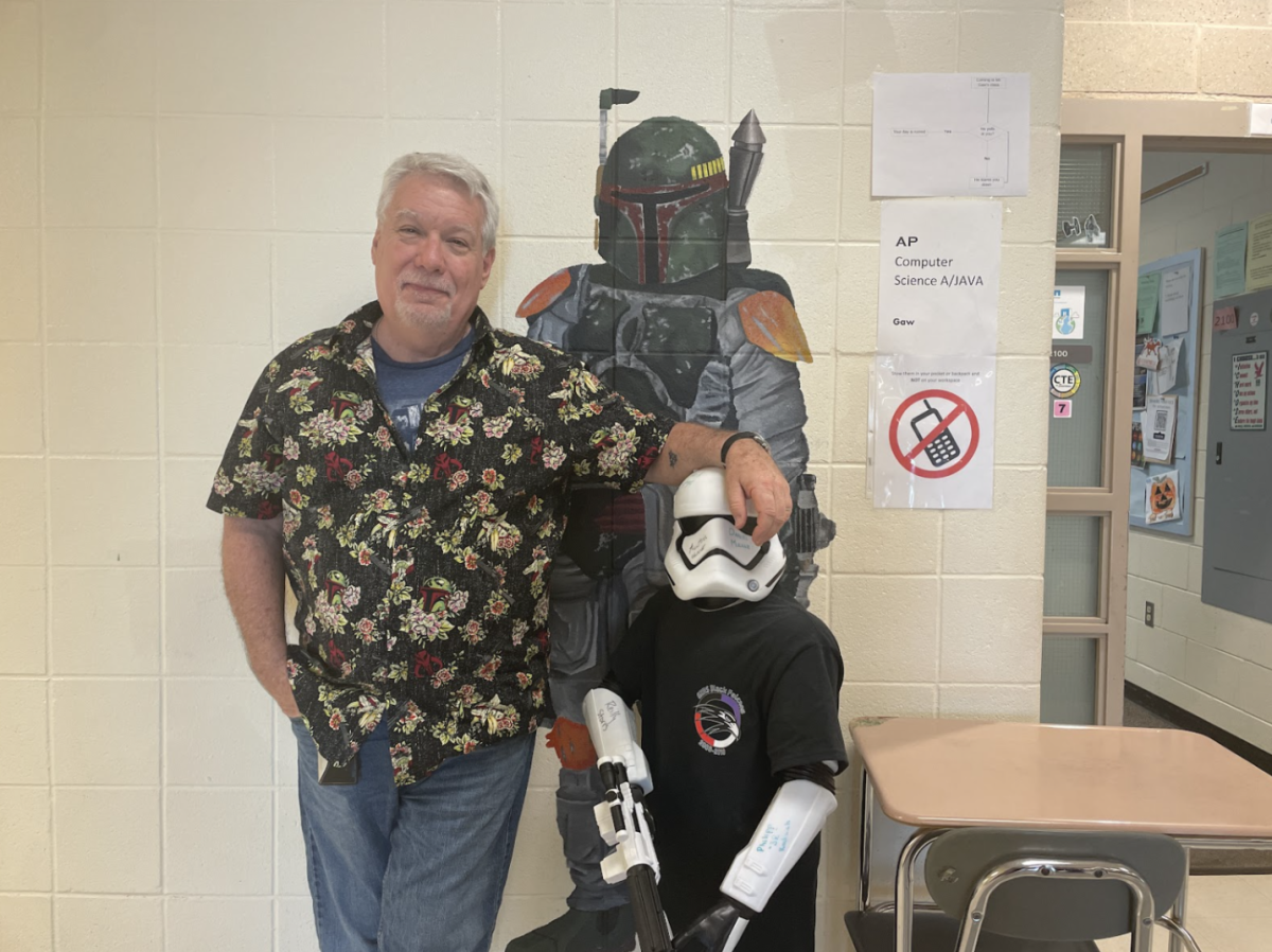 Mr. Gaw calls the day before May the 4th, “May the 4th Eve.” He celebrates by wearing a Star Wars shirt and posing with his favorite Star Wars room decor. 